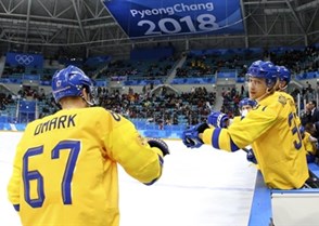 GANGNEUNG, SOUTH KOREA - FEBRUARY 15: Sweden's Linus Omark #67 celebrates at the bench with John Norman #37 after a first period goal against Norway during preliminary round action at the PyeongChang 2018 Olympic Winter Games. (Photo by Andre Ringuette/HHOF-IIHF Images)

