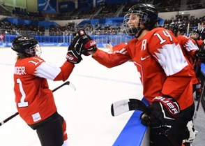GANGNEUNG, SOUTH KOREA - FEBRUARY 18: Switzerland's Sabrina Zollinger #11 high fives Evelina Raselli #14 after scoring a first period goal on Team Korea during classification round action at the PyeongChang 2018 Olympic Winter Games. (Photo by Matt Zambonin/HHOF-IIHF Images)

