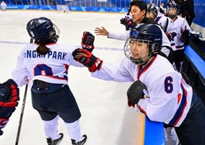 GANGNEUNG, SOUTH KOREA - FEBRUARY 20: Korea's Jongah Park #9 high fives Yujung Choi #6 after a first period goal scored by Soojin Han #17 (not shown) on Team Sweden during classification round action at the PyeongChang 2018 Olympic Winter Games. (Photo by Matt Zambonin/HHOF-IIHF Images)

